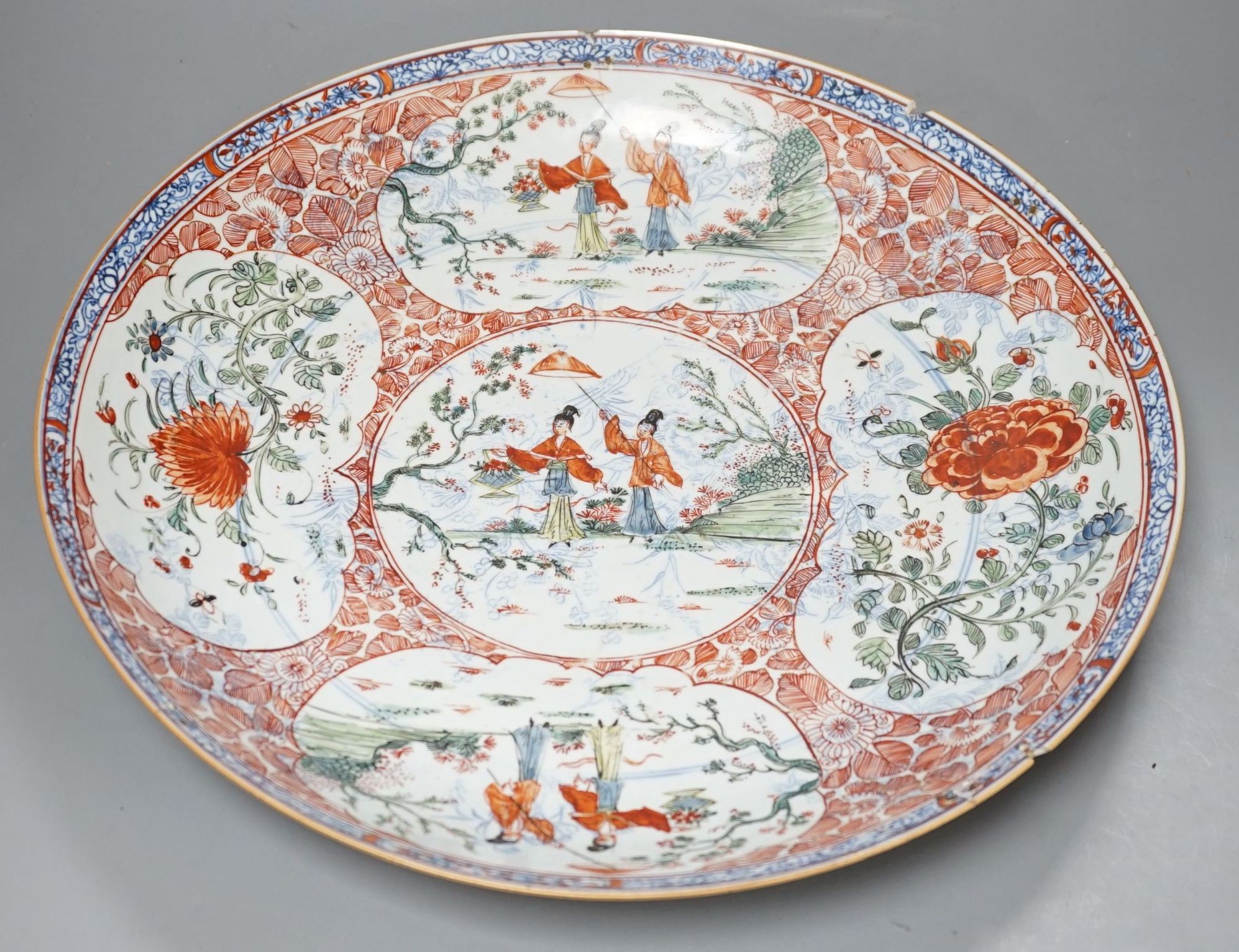 A large Chinese Kangxi dish, clobbered decoration, 37 cms diameter.